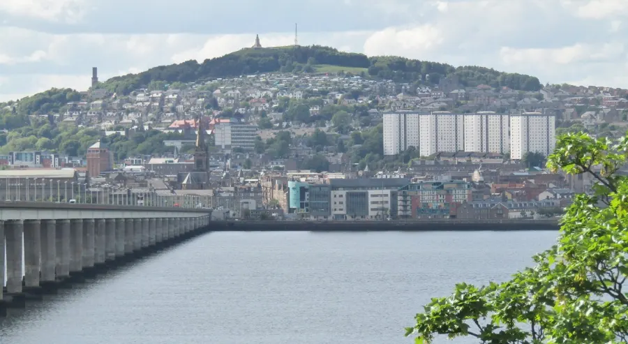 The city of Dundee with Dundee Law dominating the skyline - seen across the River Tay from the Fife shore.