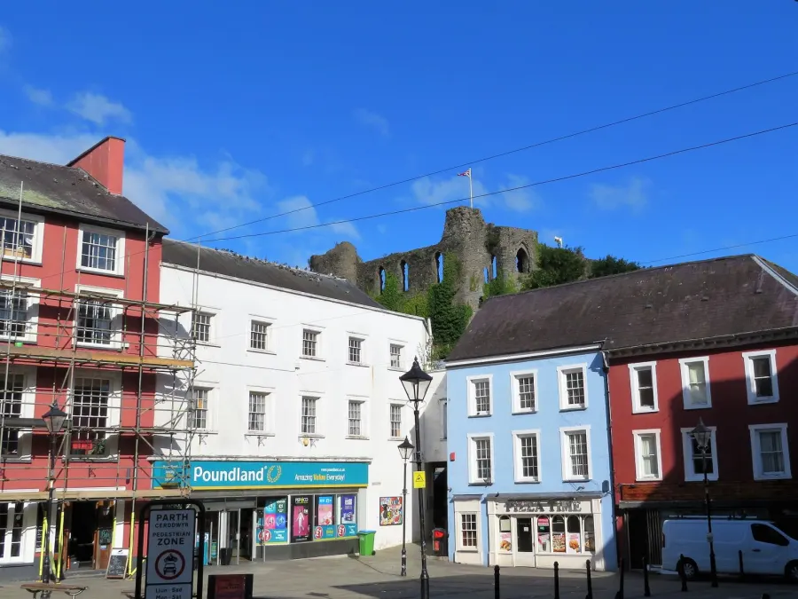 View towards Haverfordwest Castle looking over shops in Castle Square in the town centre below.