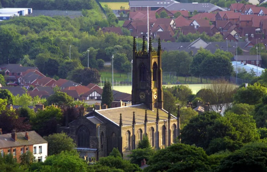 Roofscape of Horwich, Greater Manchester, England, looking southwest at Holy Trinity parish church