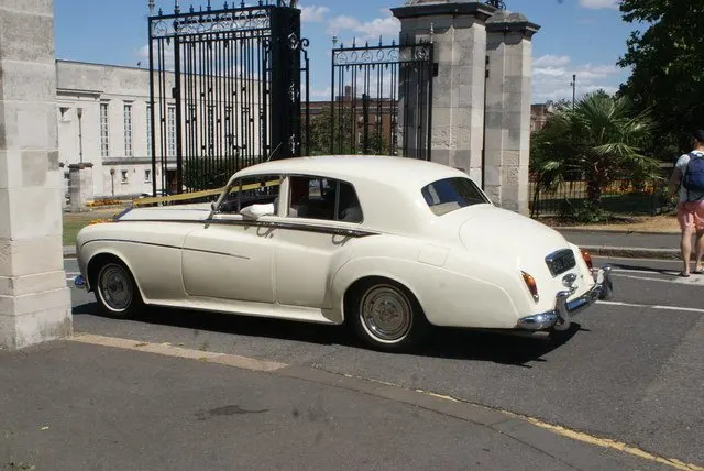View of a 1964 Rolls Royce Silver Cloud III parked outside Waltham Forest Town Hall for a wedding