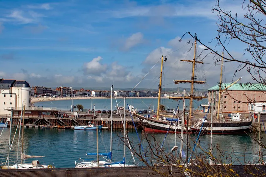 Weymouth harbour and bay, 3 masted sailing ship Pelican of London foreground